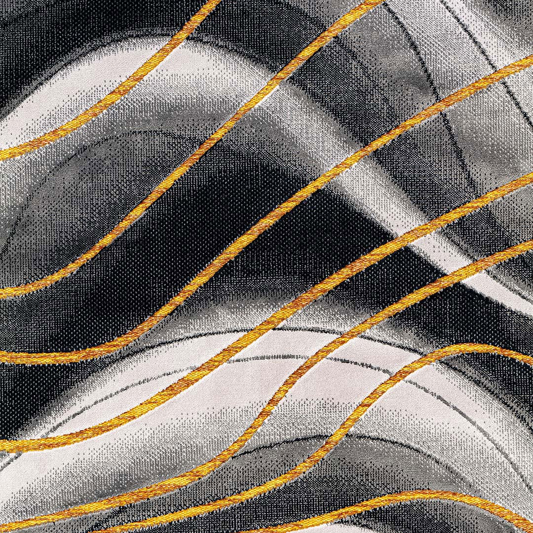 Gros plan sur le motif 3D à ondes et les courbes jaune-orange du tapis Gabrielle Ondes Gris Jaune