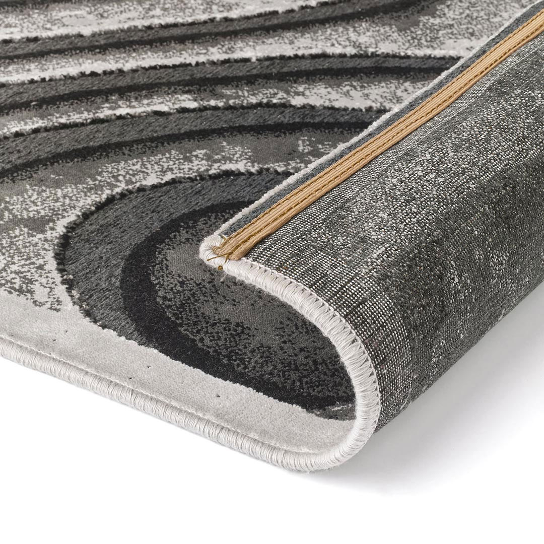 Gros plan sur motif 3D curviligne en nuances de gris