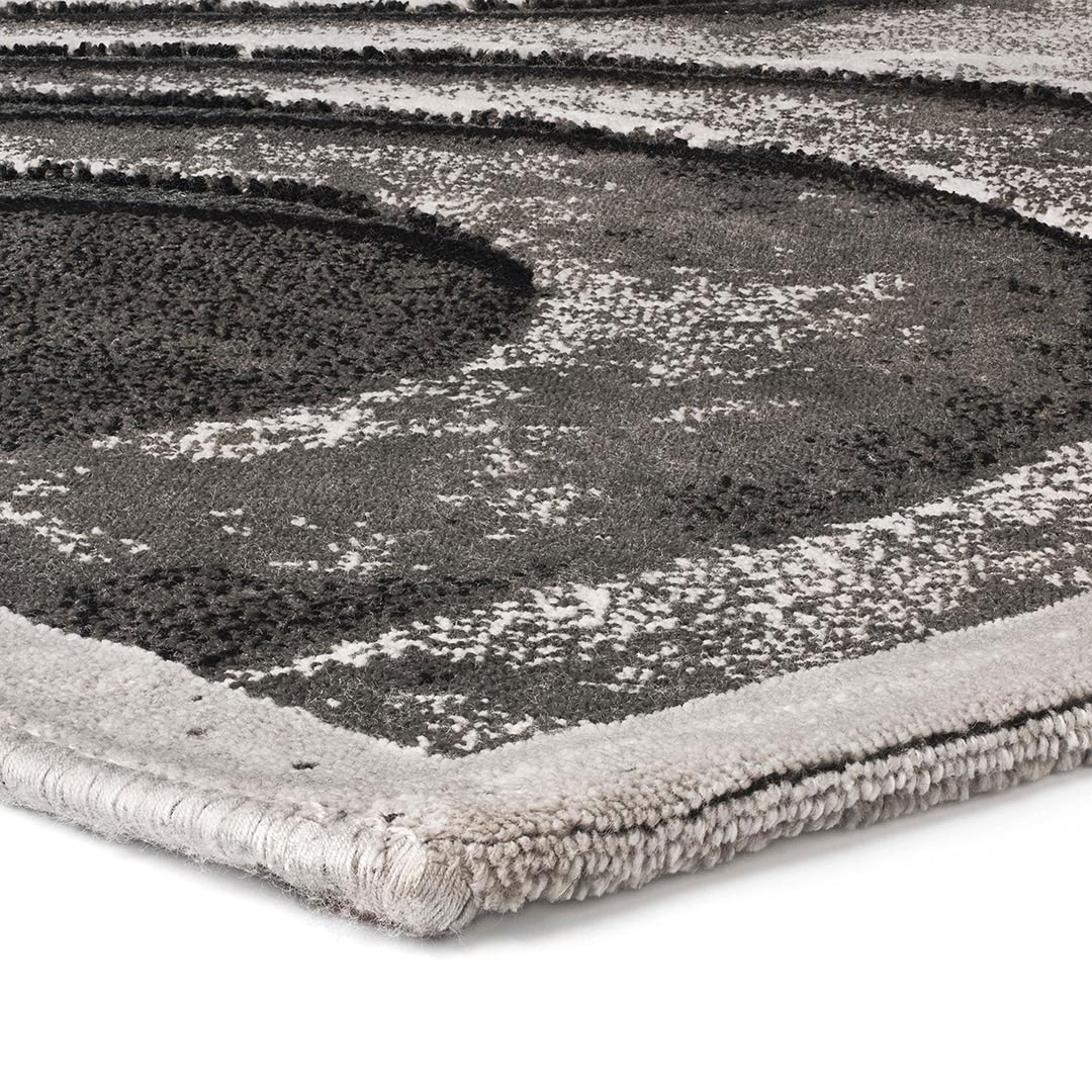 Gros plan sur motif 3D curviligne en nuances de gris