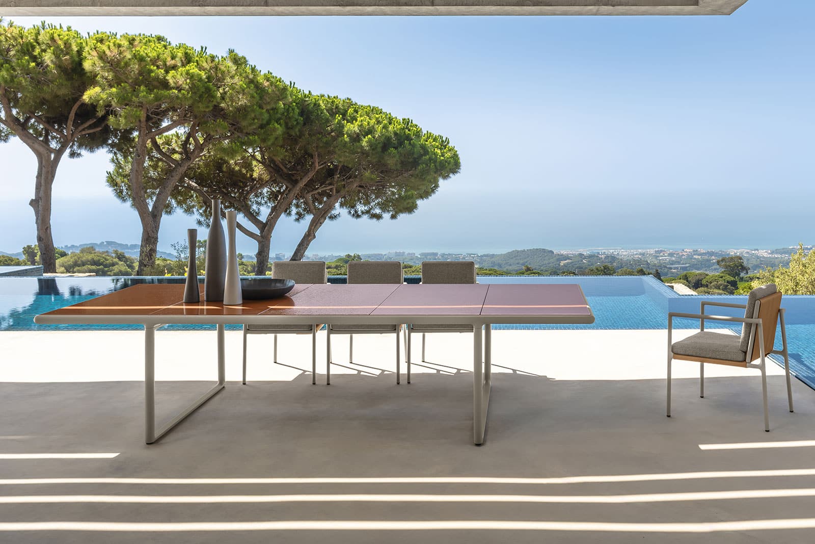 Trex outdoor table with coral lava stone top 340 x 120 cm